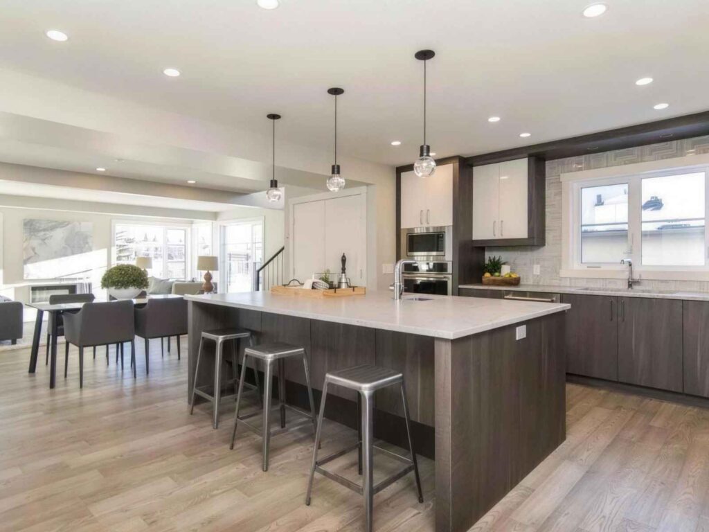 Kitchen renovations Toronto project with white cabinetry and steel appliances