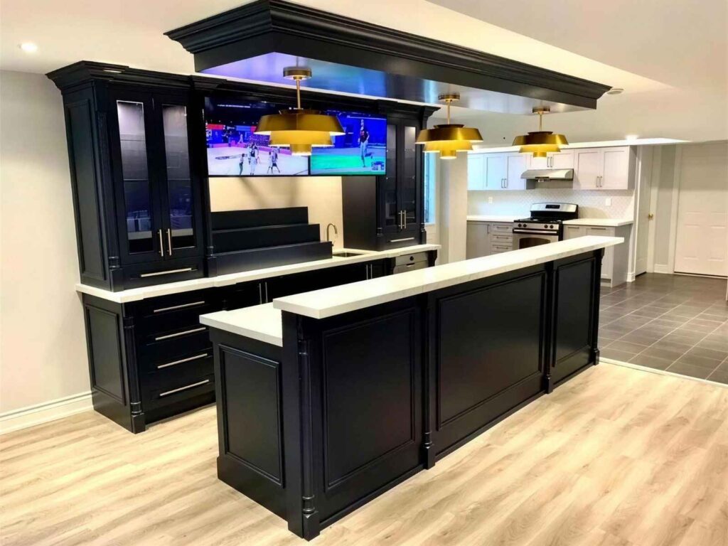 Legal basement renovations project with custom bar and media wall